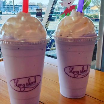 Two Long Island milkshakes topped with whipped cream