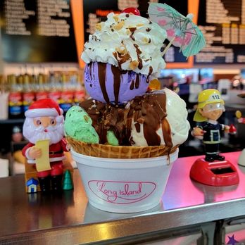 Loaded sundae in a Long Island waffle bowl with a cocktail umbrella